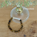 boutique de Mamie Lucie, bracelets en pierre naturelle, collection de bracelets, bracelet 7 chakras, bracelet protection, bracelet bien-être, bracelet lithothérapie, lithothérapie, pierres naturelles, énergie positive, harmonie, apaisement, sérénité, protection énergétique, équilibre émotionnel, ancrage, confiance en soi, méditation, spiritualité, développement personnel, cadeau bien-être, Saint-Louis, Bâle, Strasbourg, Colmar, Mulhouse, Dietwiller, Obersaasheim