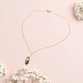 boutique de Mamie Lucie, collier en pierre naturelle, collier lithothérapie, lithothérapie, pierres naturelles, bien-être, apaisement, sérénité, harmonie, énergie positive, protection énergétique, équilibre émotionnel, confiance en soi, développement personnel, méditation, spiritualité, ancrage, clarté mentale, cadeau bien-être, Saint-Louis, Bâle, Strasbourg, Colmar, Mulhouse, Dietwiller, Obersaasheim